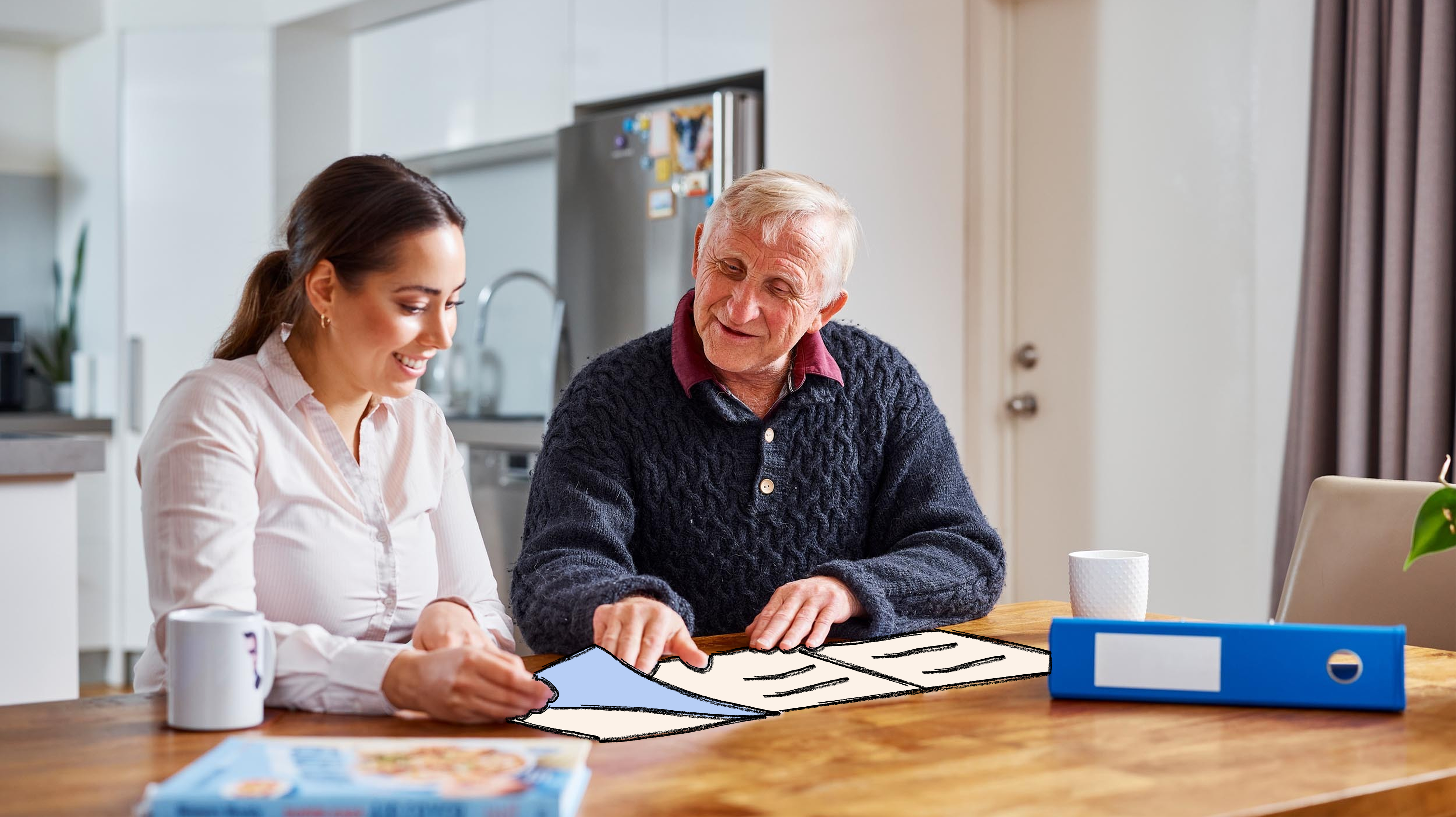 Hireup client Dirk and his support worker Brenda go through some paperwork on his dining table.