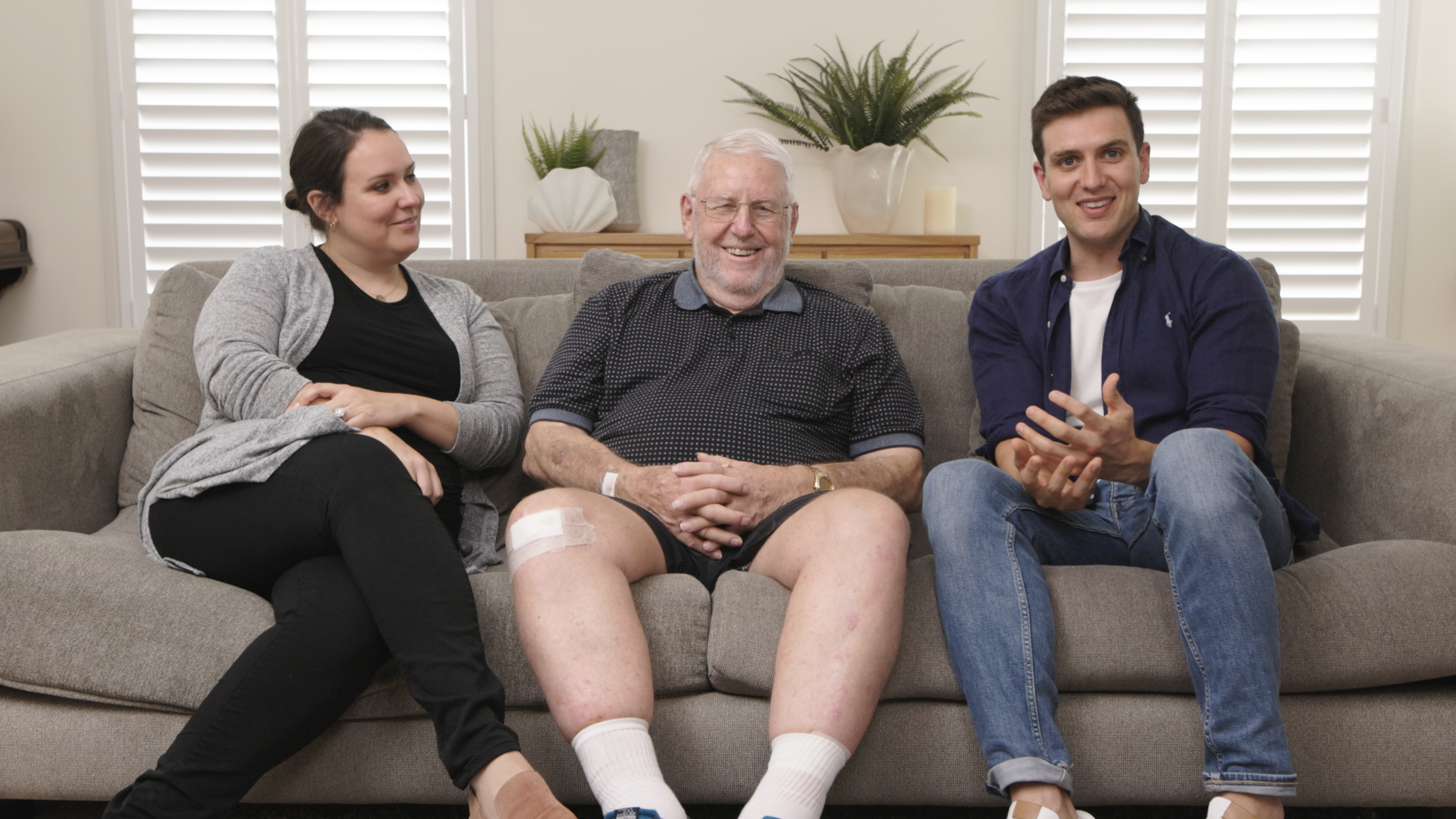 Hireup co-founders Laura and Jordan O'Reilly chatting on the couch with their dad Frank.