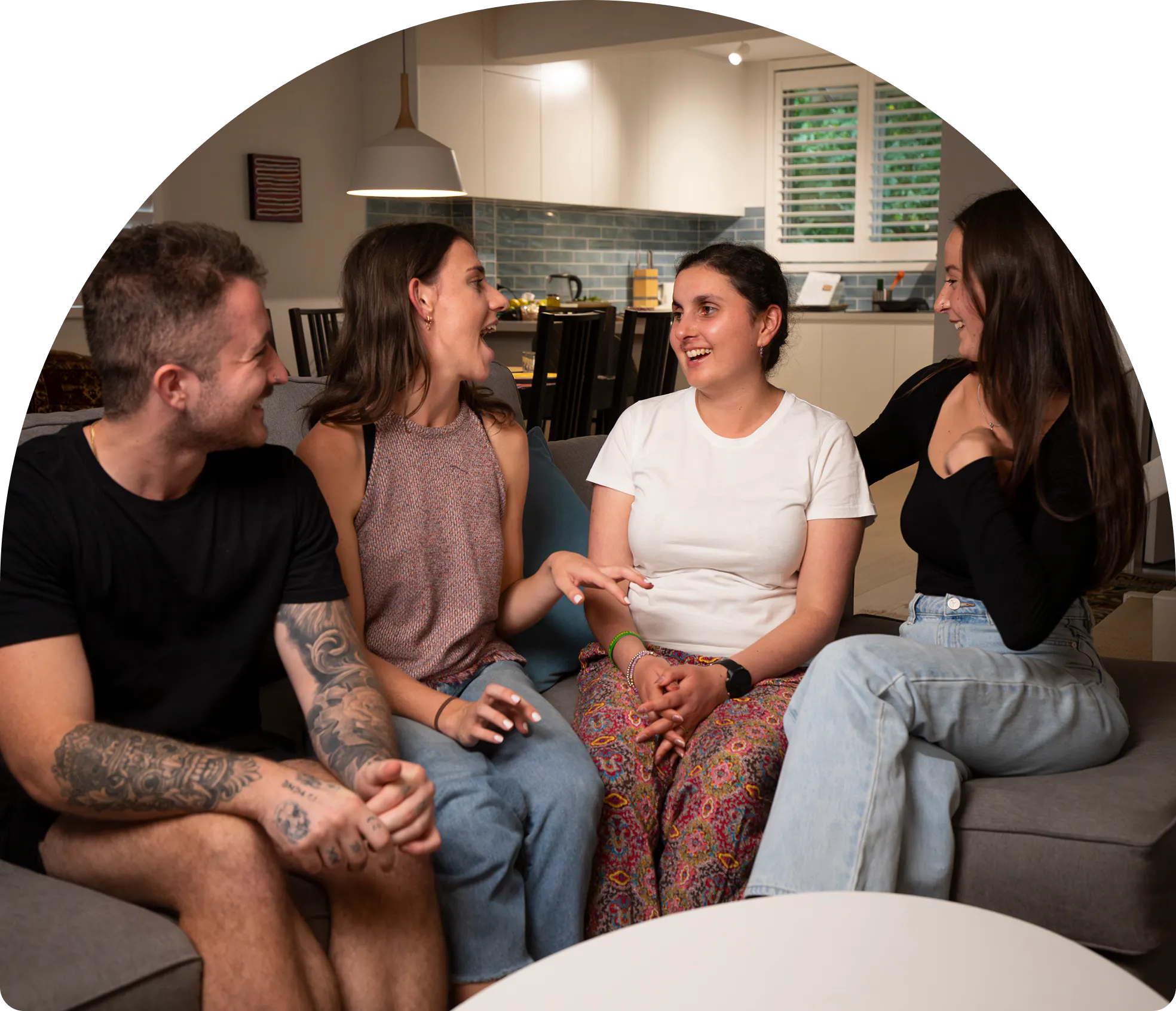 Hireup client Ari chats with her support team on her couch.