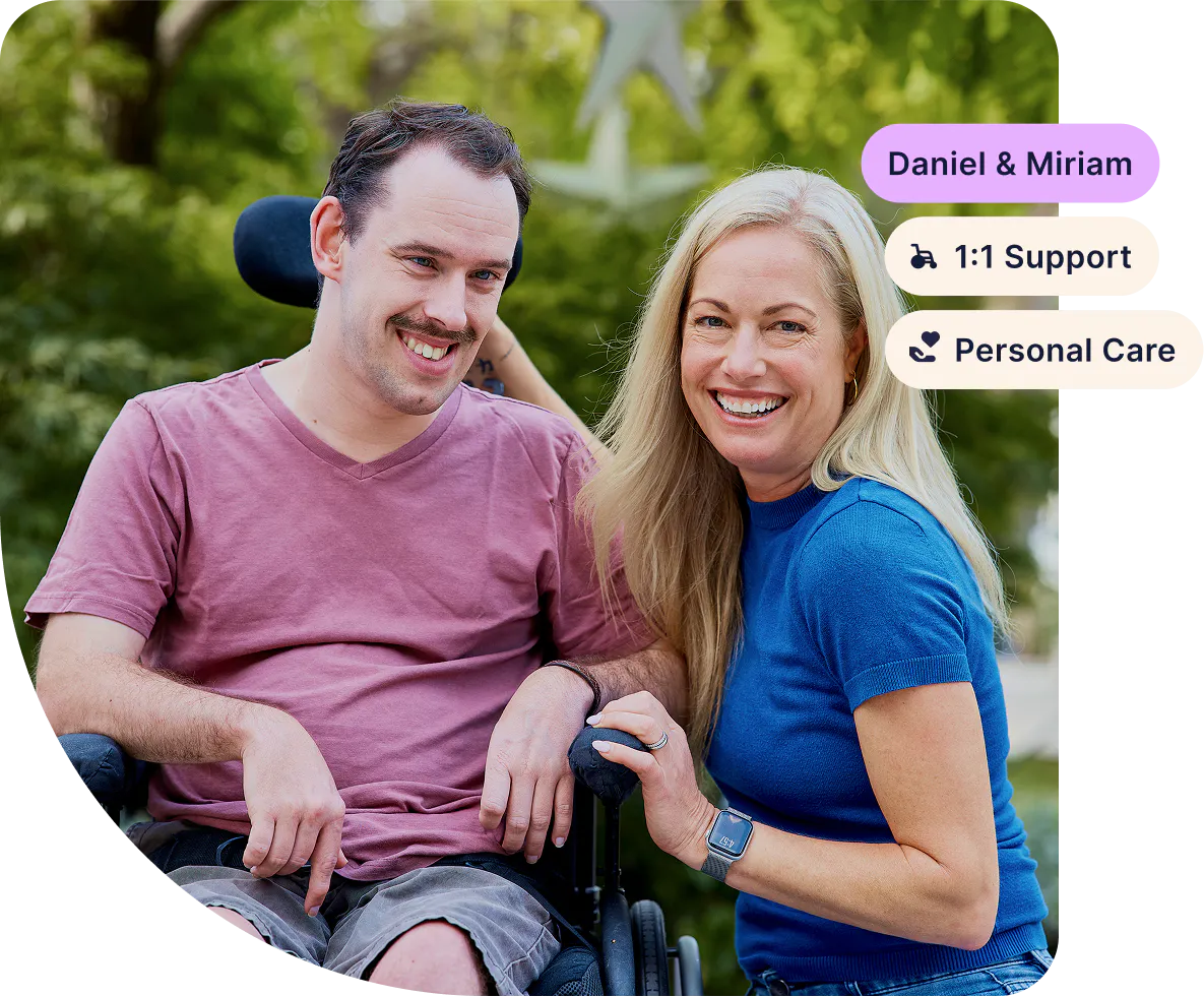 Hireup client Daniel smiles at the camera with his support worker Miriam. Tags in the corner show their names and support types, "1:1 support" and "personal care".
