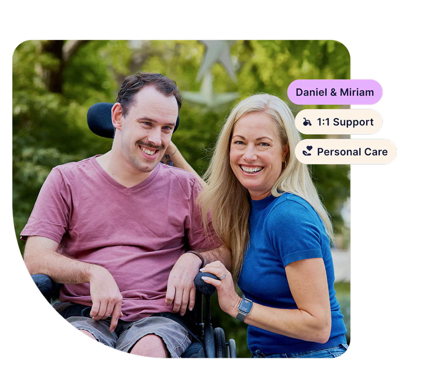 Hireup client Daniel smiles at the camera with his support worker Miriam. Tags in the corner show their names and support types, "1:1 support" and "personal care".