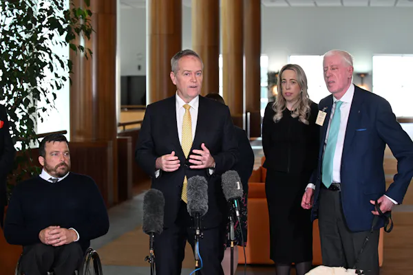 National Disability Insurance Agency (NDIA) chair Kurt Fearnley, Minister for Government Services Bill Shorten, NDIS CEO Rebecca Falkingham and Dr Graeme Innes at a press conference at Parliament House, in Canberra, Monday, September 26, 2022.