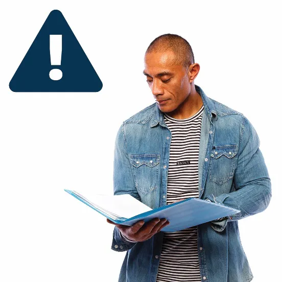 A man looking at a document with an important icon next to him