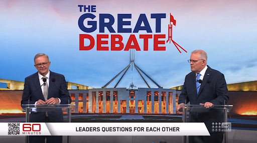 Anthony Albanese and Scott Morrison are standing at podiums in front of a picture of Parliament House and the words "The Great Debate"