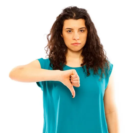 A woman frowning with thumbs down