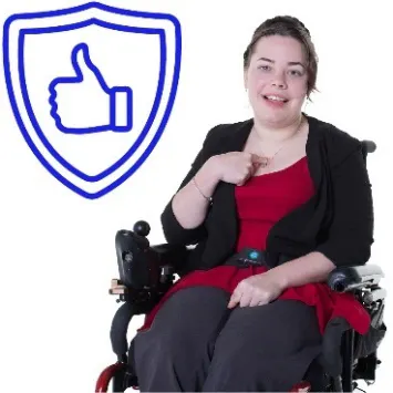 A woman with disability points to herself. Next to her is a safety icon.