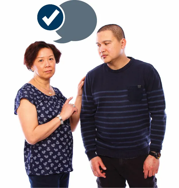 A woman supporting a man. She has a speech bubble and a tick