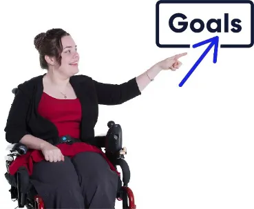 A woman points to the word goals.