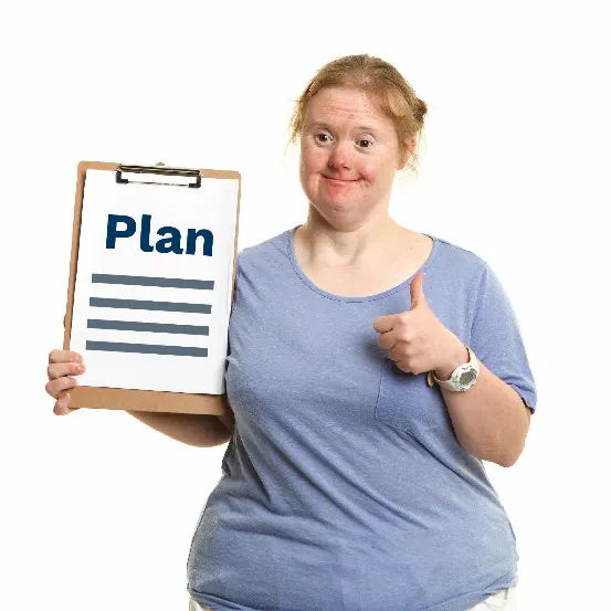 A woman smiling, holding a plan with a thumbs up