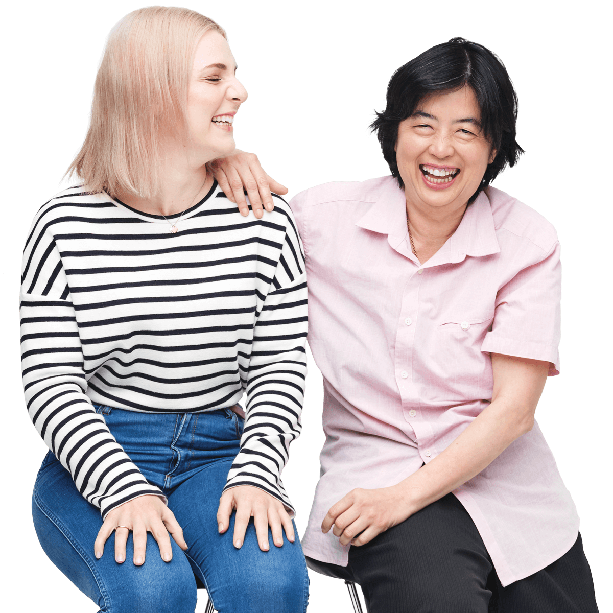 A support worker and Hireup user, seated, smiling.