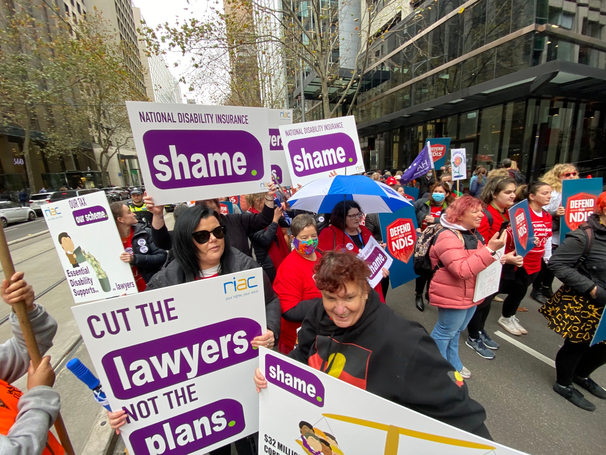 A group of advocates march in the Every Australian Counts Defend our NDIS rally in Melbourne's CBD.