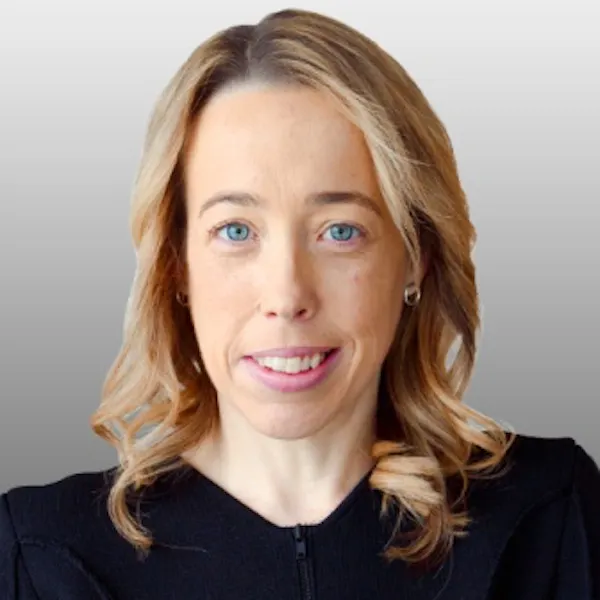 Image shows: profile photo of Rebecca Falkingham smiling directly at the camera. She has long blonde hair and blue eyes and is wearing a black shirt.