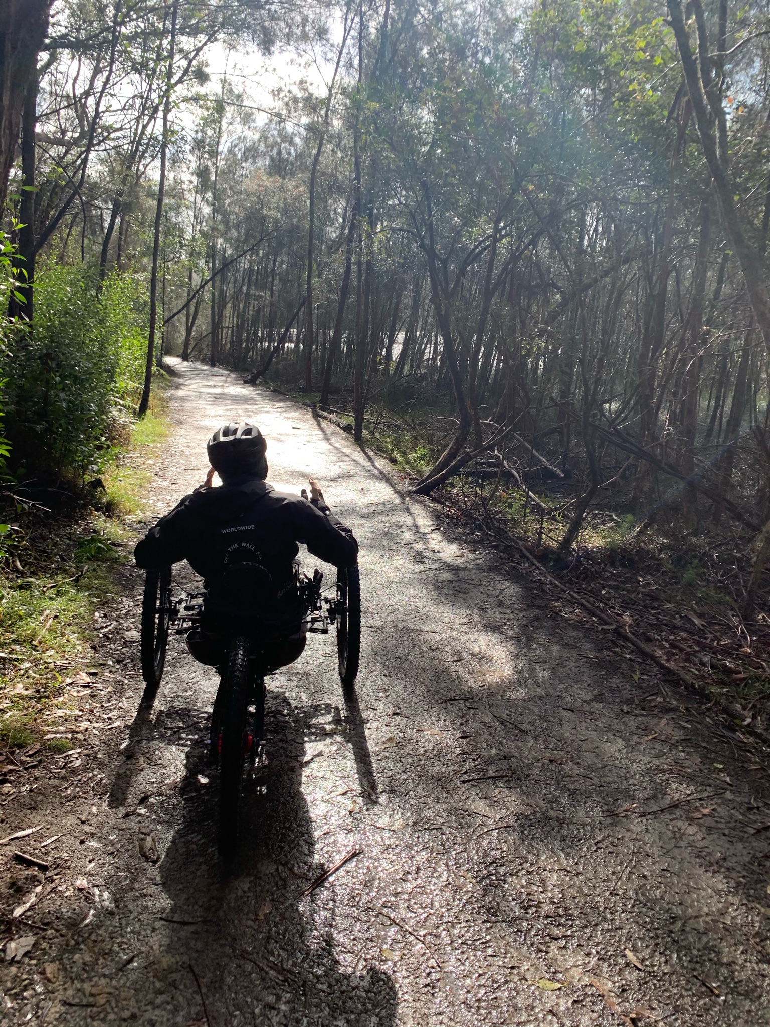 Steven Ralph explores a bush track in an adapted bike.