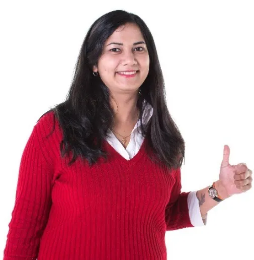 A woman smiling with a thumbs up