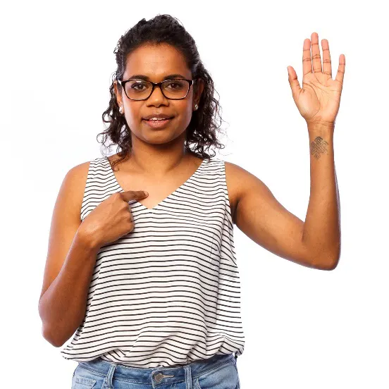 A woman with one hand raised and the other pointing at herself