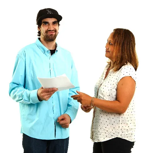 A man handing a document to a woman