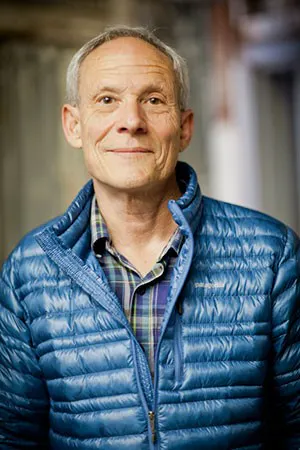 Vincent Stanley is wearing a blue puffer jacket.