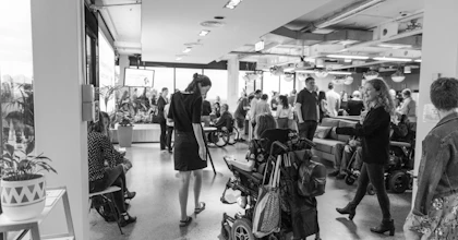 Hireup support office staff are gathered at the Hi-Con event. The image is black and white.