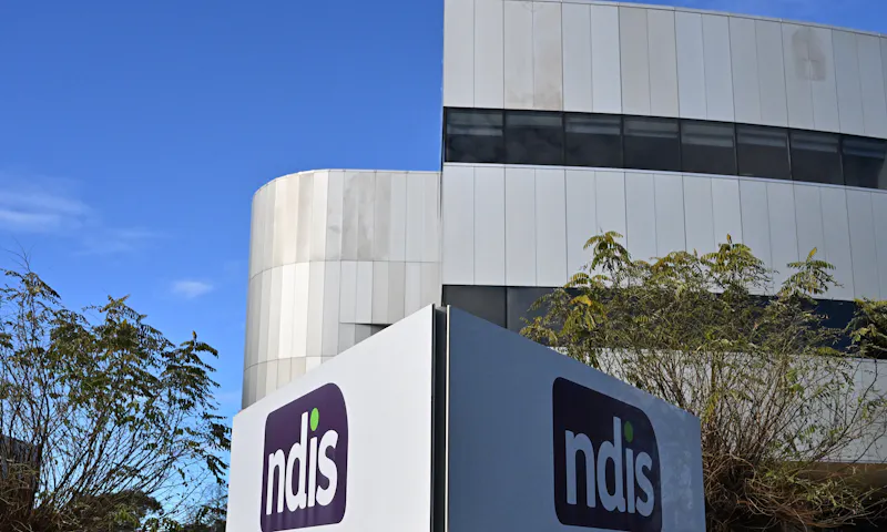 Exterior of NDIS building with an NDIS sign in the foreground.
