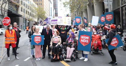A group of advocates march in the Every Australian Counts Defend our NDIS rally in Melbourne's CBD.