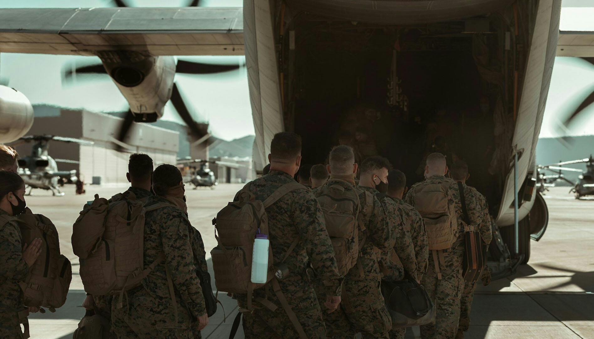 American soldiers boarding a plane