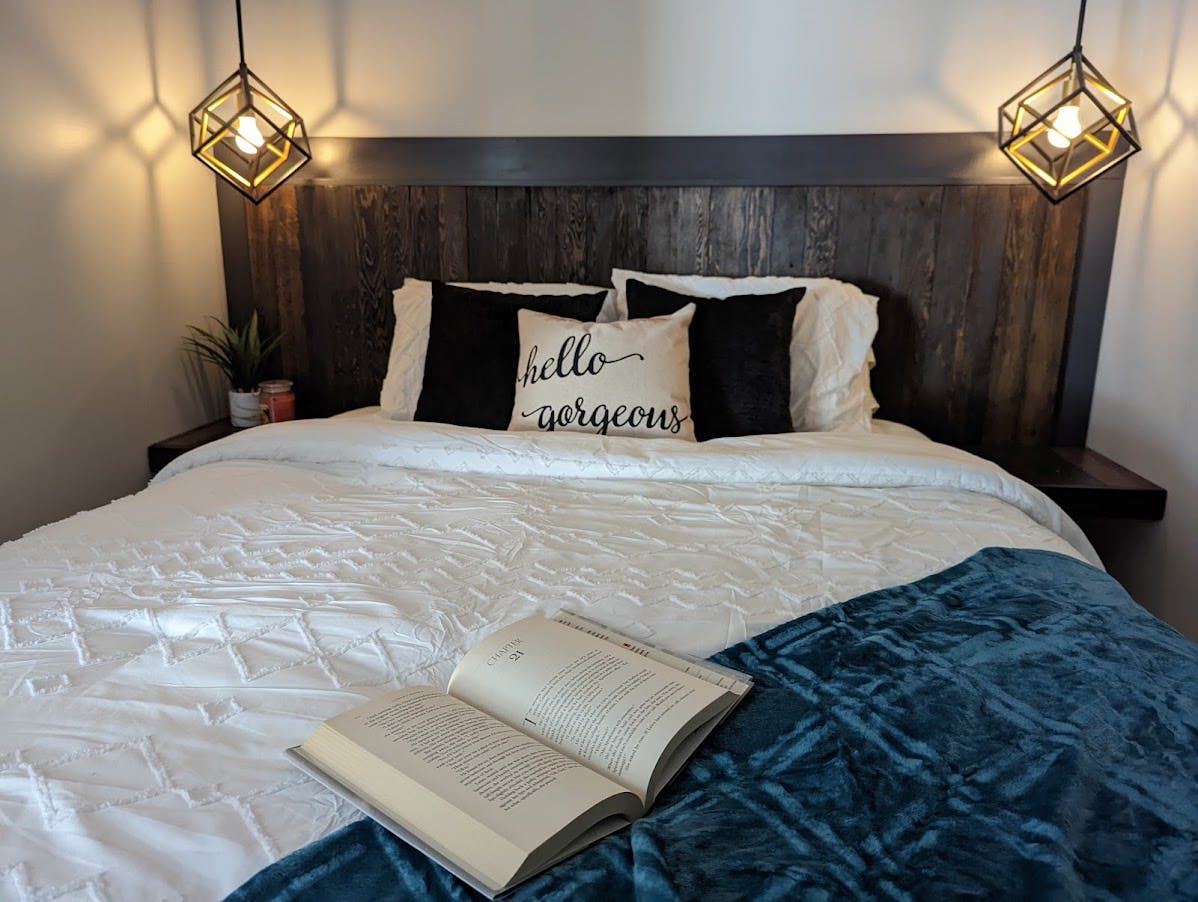 Staged bed with book and custom throw pillows