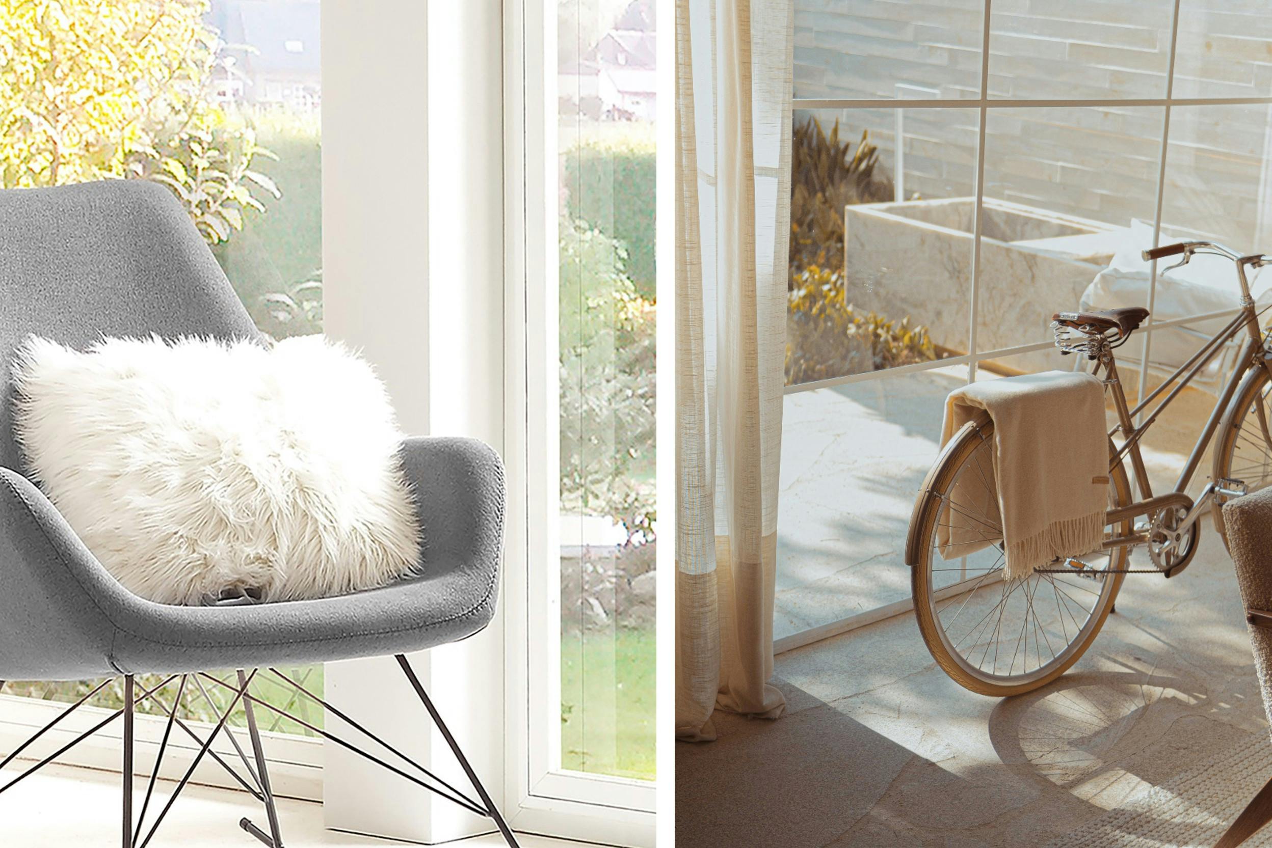 Comfortabele grijze schommelstoel voor grote ramen.