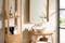 Salle de bain de style scandinave avec meuble sous lavabo en bois clair équipé d'une vasque en céramique 