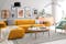 Gelbes Ecksofa und mintgrüner Sessel kombiniert mit weißen Skandi-Möbeln und grafischem Schwarz-Weiß-Muster; rosa und gelbe Candy Colors peppen die weiße Skandi-Essecke fröhlich auf.