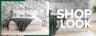 Boxspringbett KINX aus weißem Strukturstoff mit weißer Bettwäsche und einer grauen Decke vor einer Wand im Marmor-Look. Dazu zwei schwarz-weiße Pendelleuchten, ein weißer flauschiger Teppich sowie Möbel im Retro-Stil aus schwarzem Holz mit Wiener Geflecht.