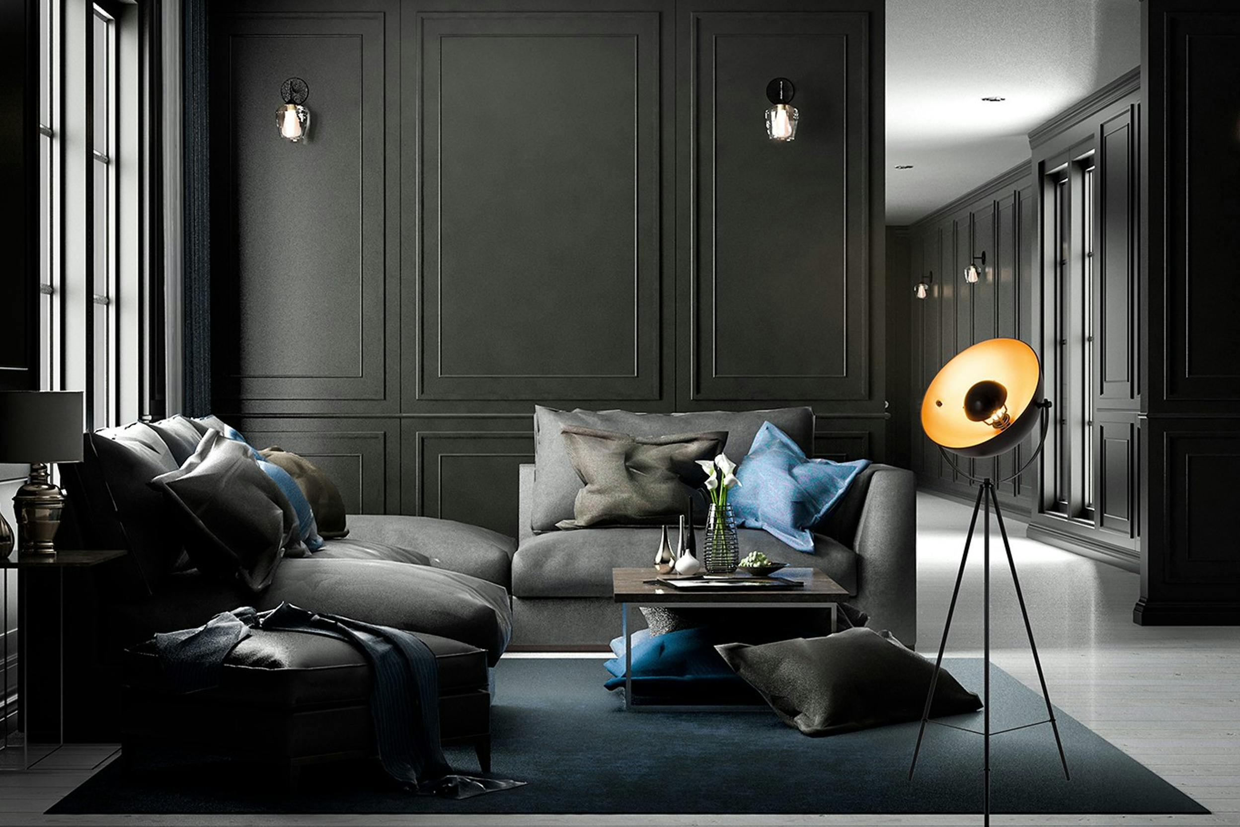 grande pièce aux murs noirs avec grandes fenêtres, meubles gris foncés, coussins bleus, tapis gris, lampes noires