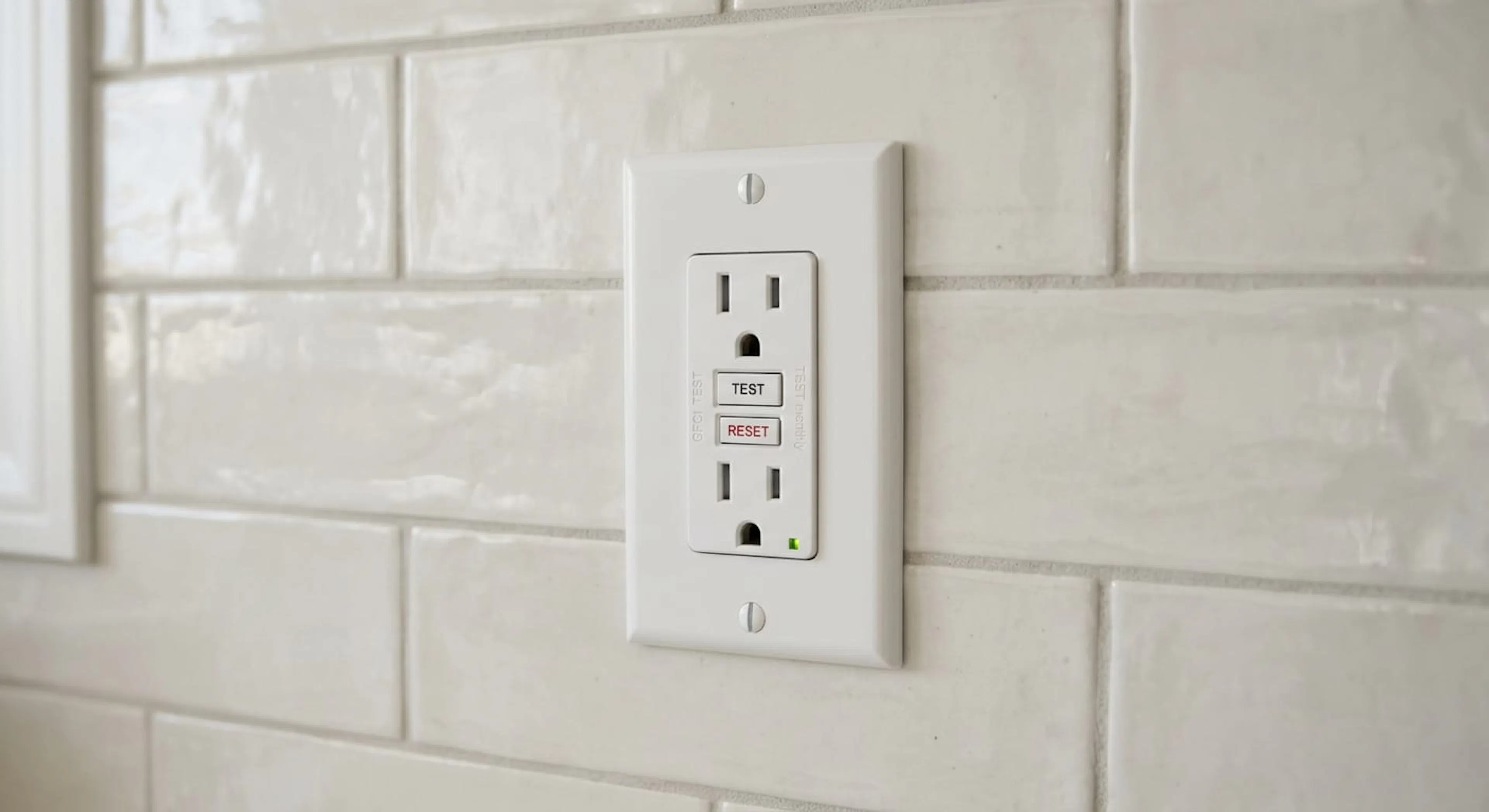 GFCI outlet with test and reset buttons