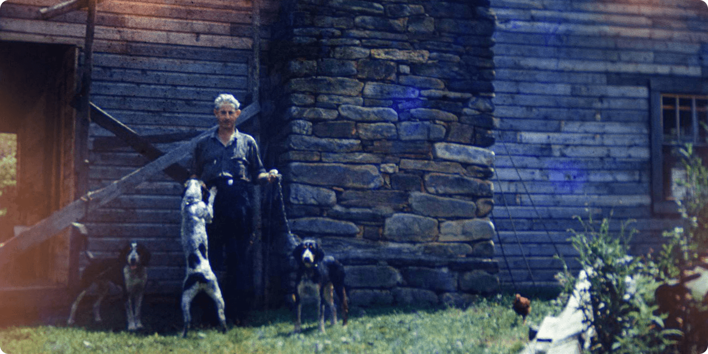 Yancey homesteader with his hunting dogs, late 1950's