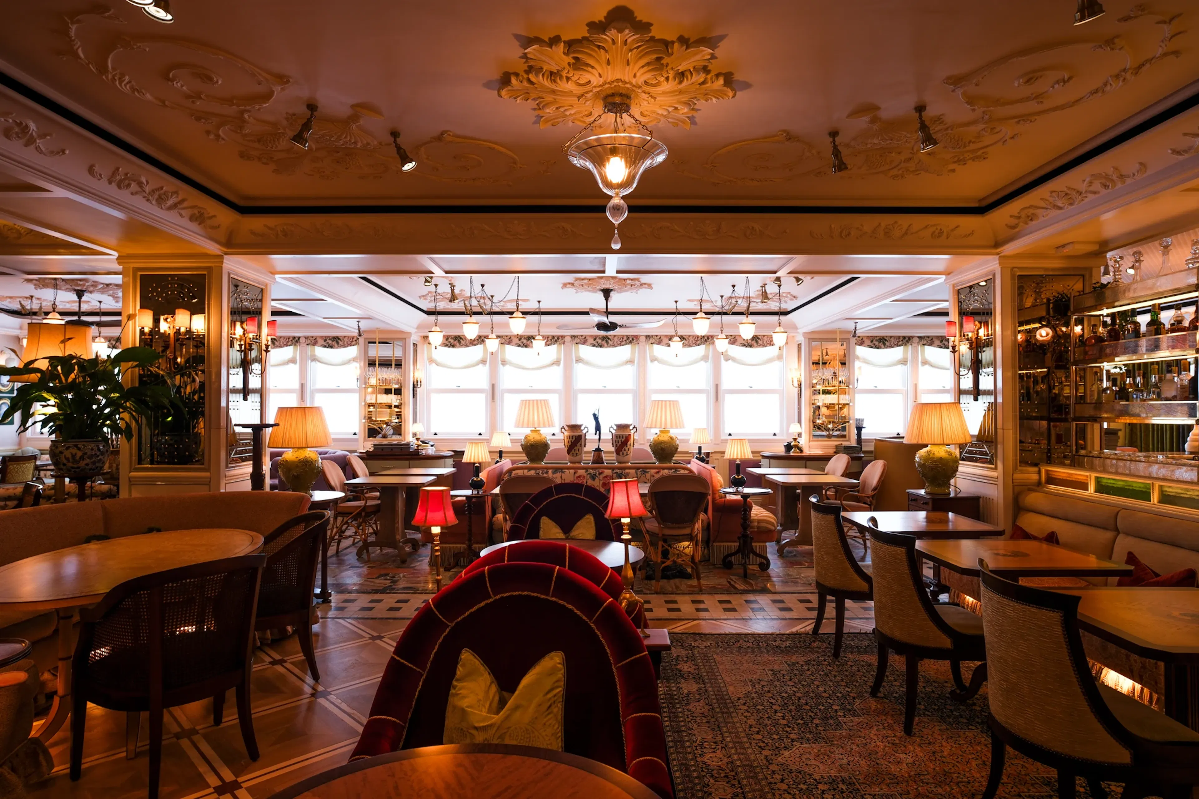 Lamplit dining room at Lilibet's, London, with K-array speakers nowhere to be seen