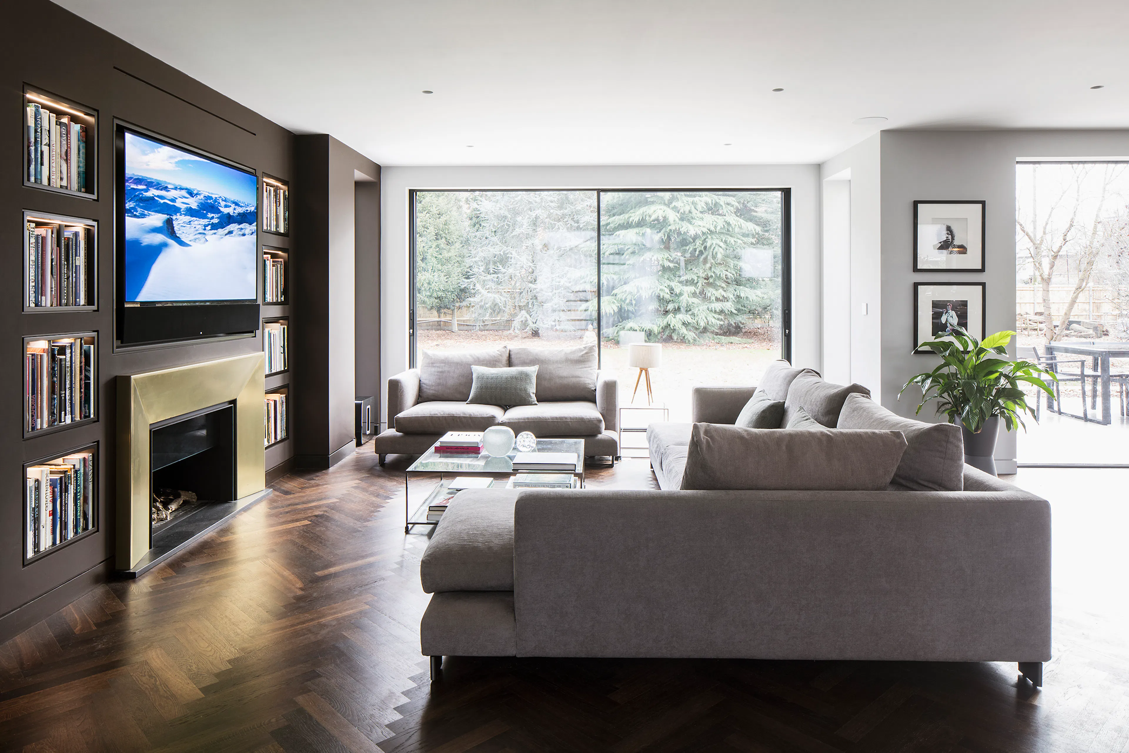 Family lounge with herringbone floor and no visible speakers