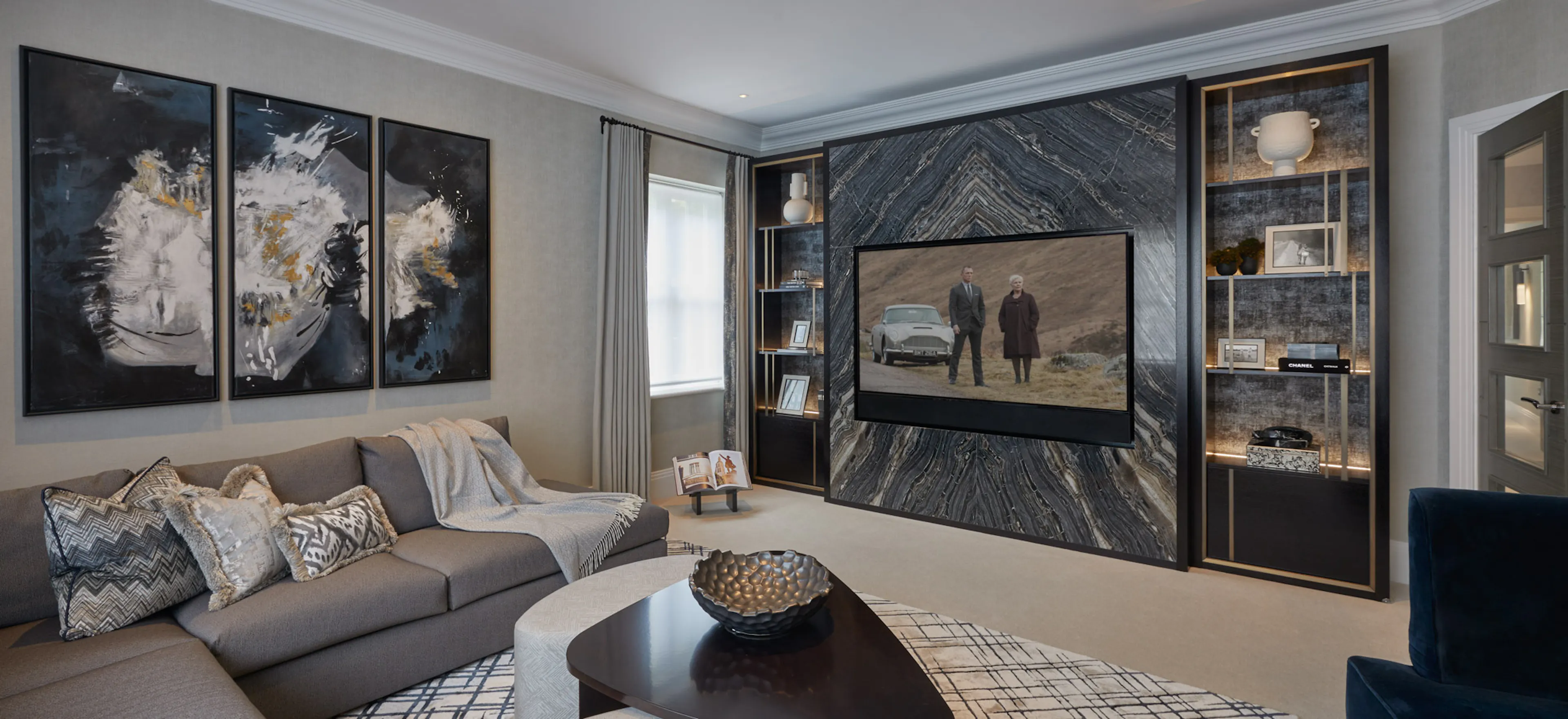 Media wall with a soundbar concealed in bespoke joinery