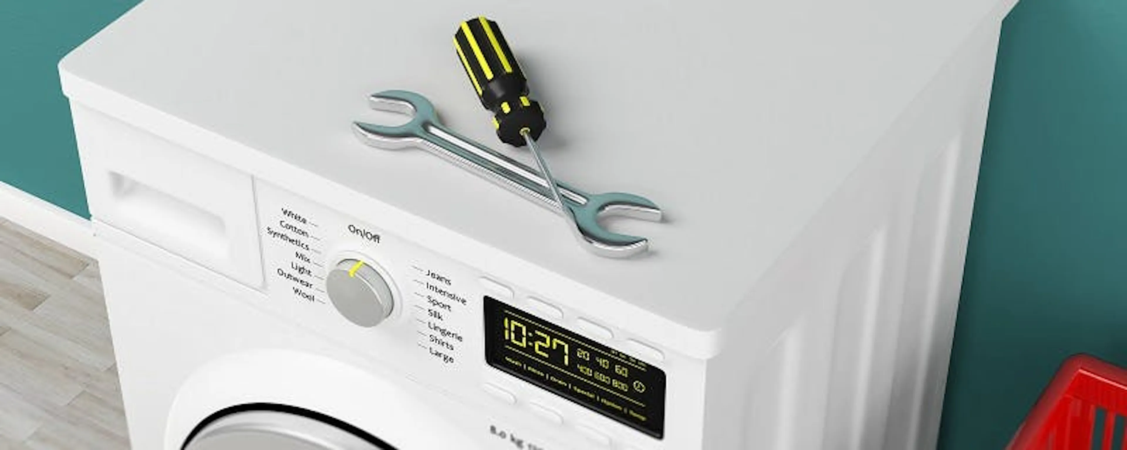 Sèche-linge qui ne chauffe plus avec clé et tournevis posés dessus