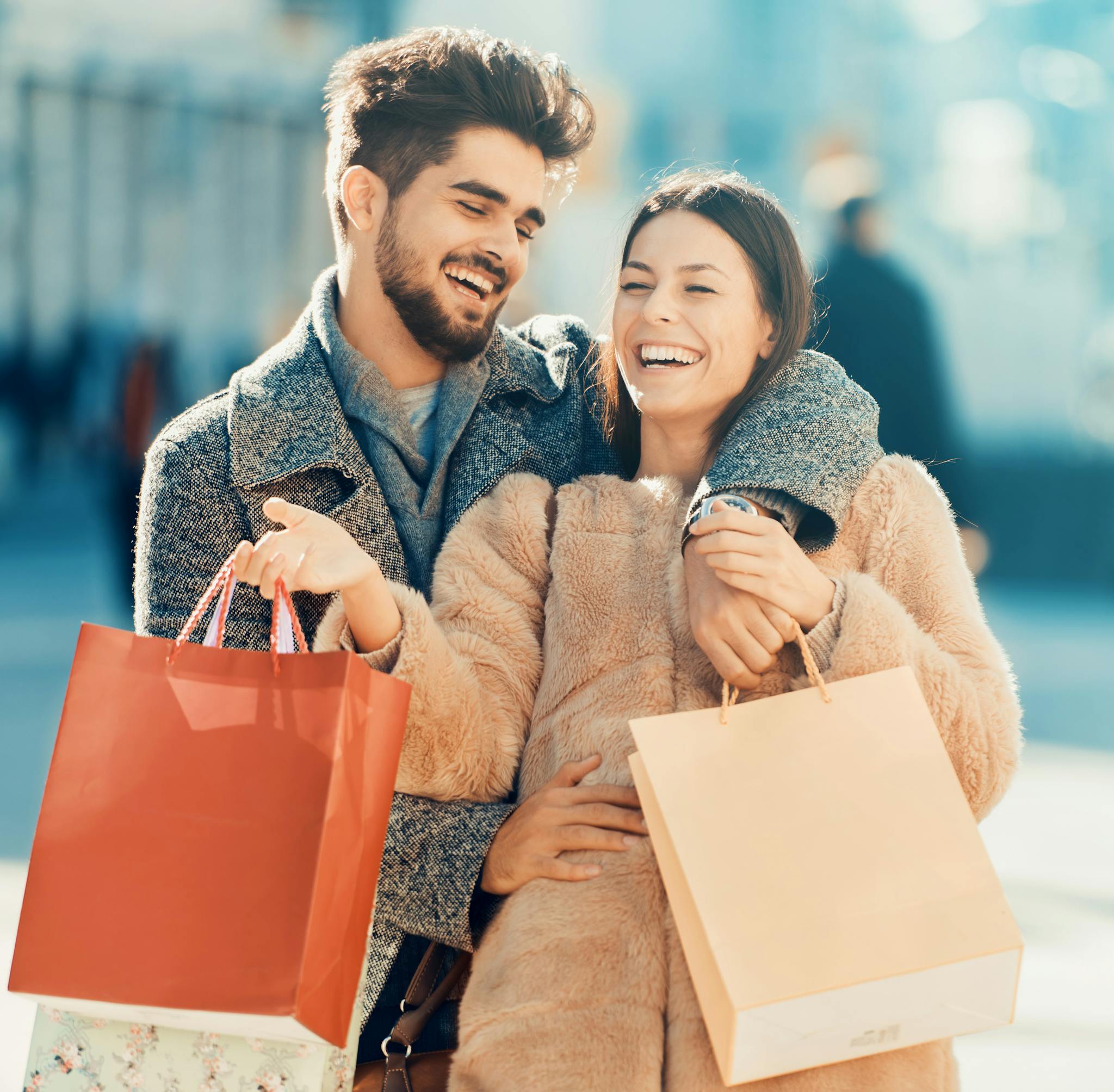 Stock photo of couple shopping and laughing