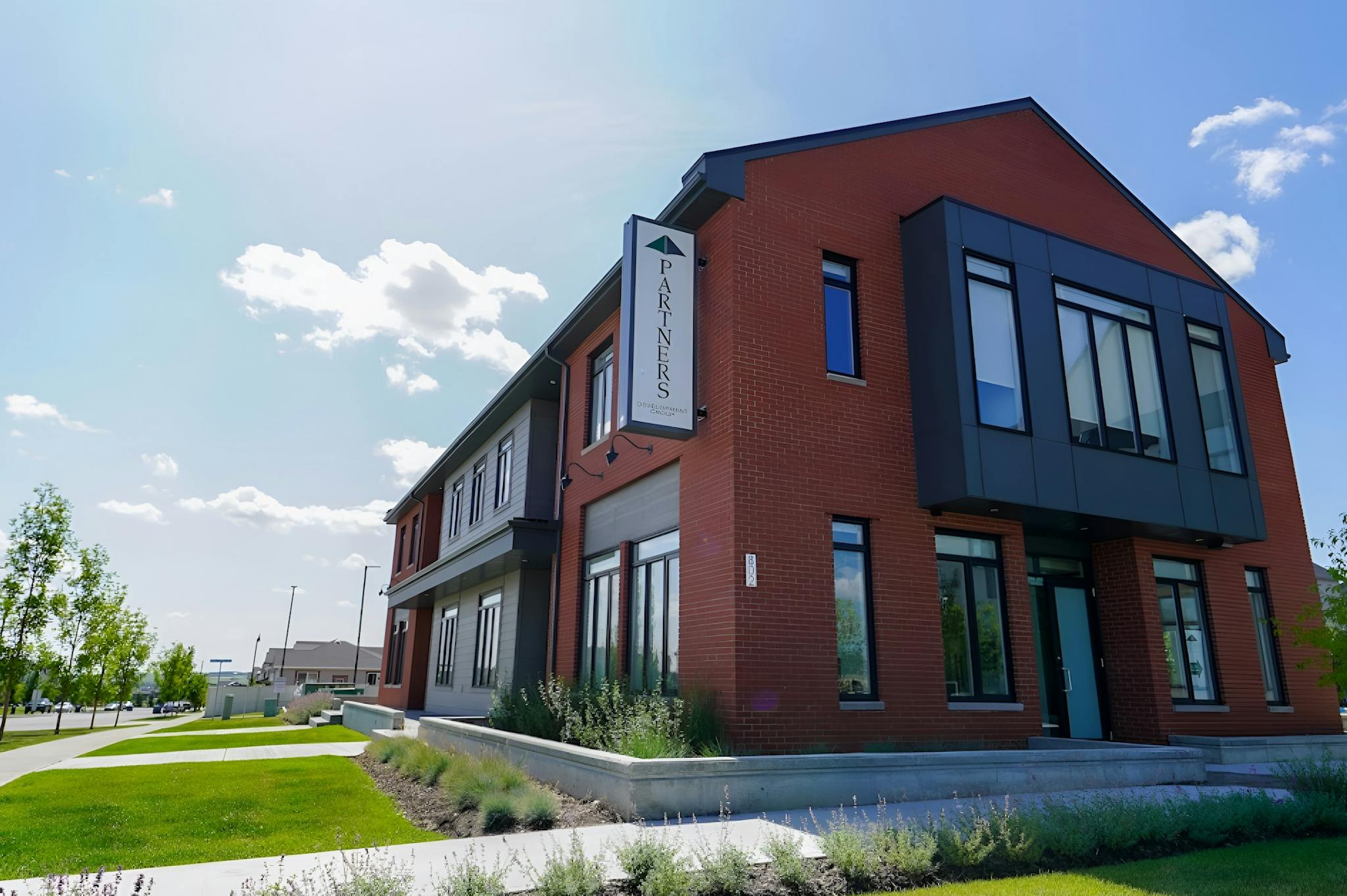 Wide shot of Partners Development Group's office building.