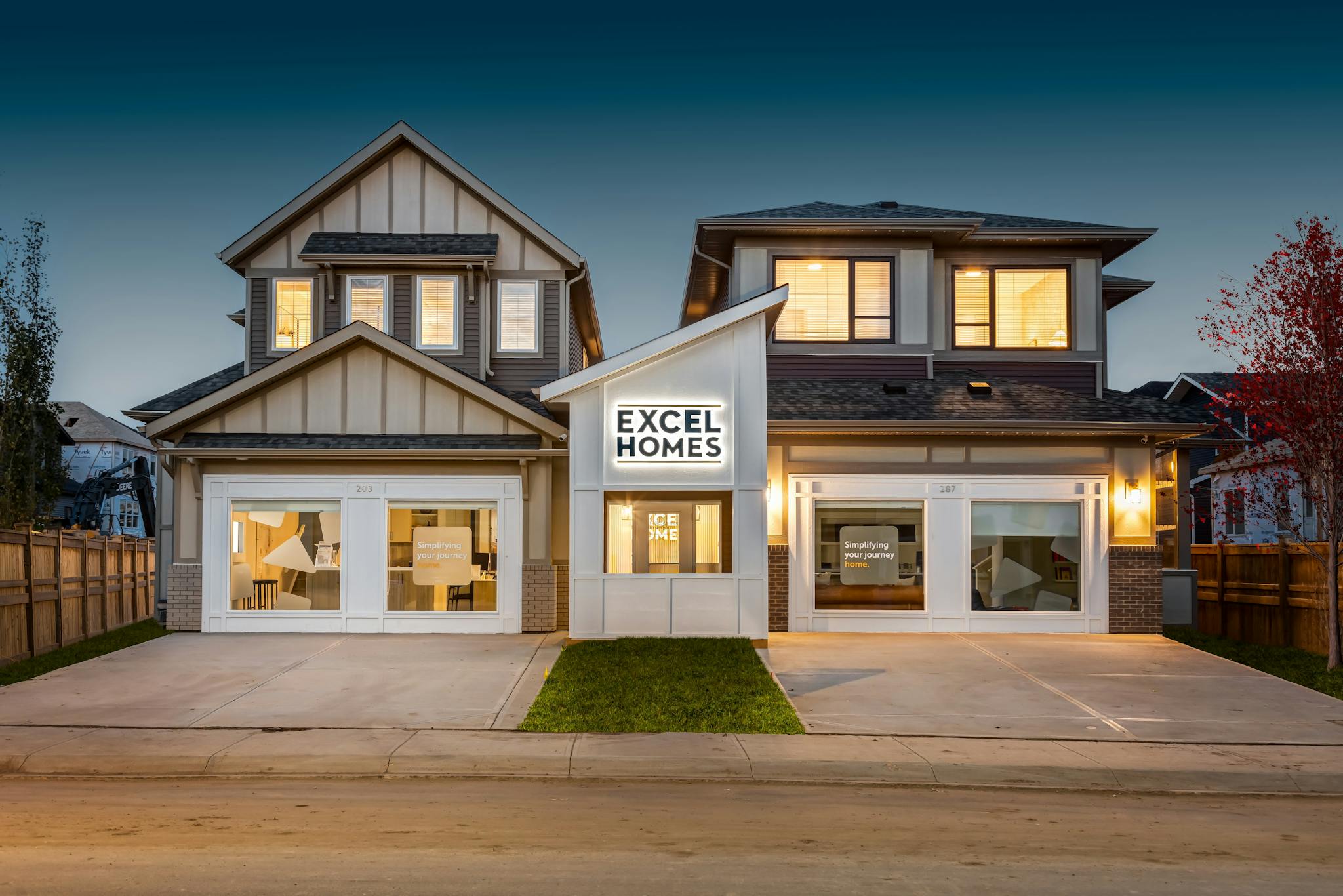 Showhomes by Excel Homes, side by side under an evening sky