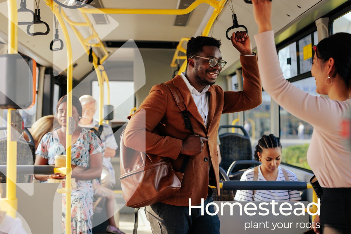 Two people chat on the bus, with text overlaid reading 'Homestead: Plant Your Roots'