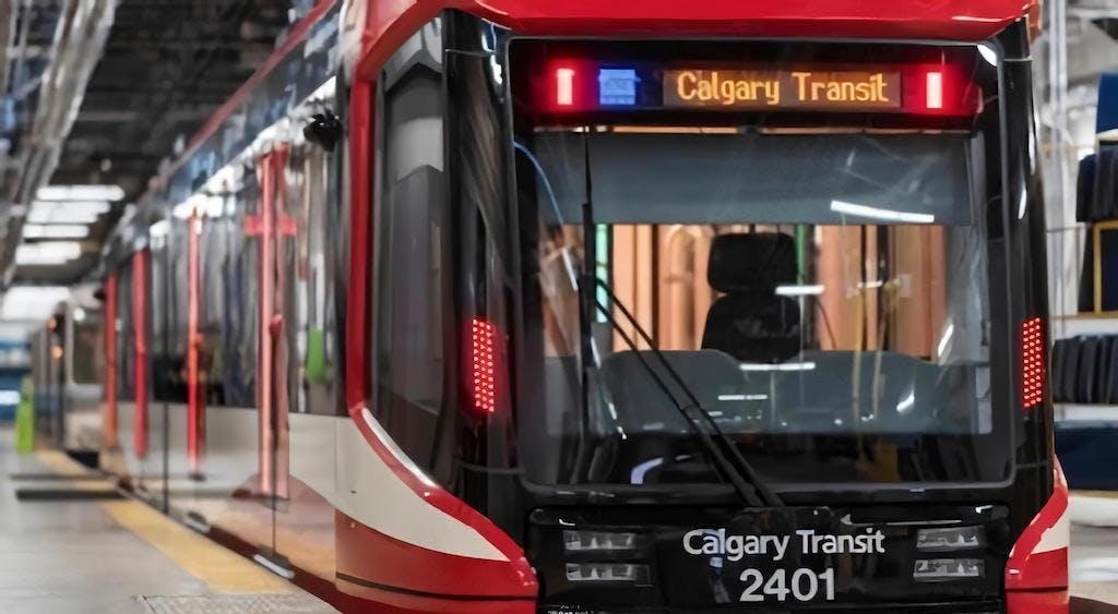 A red and white train labeled 'Calgary Transit 2401'