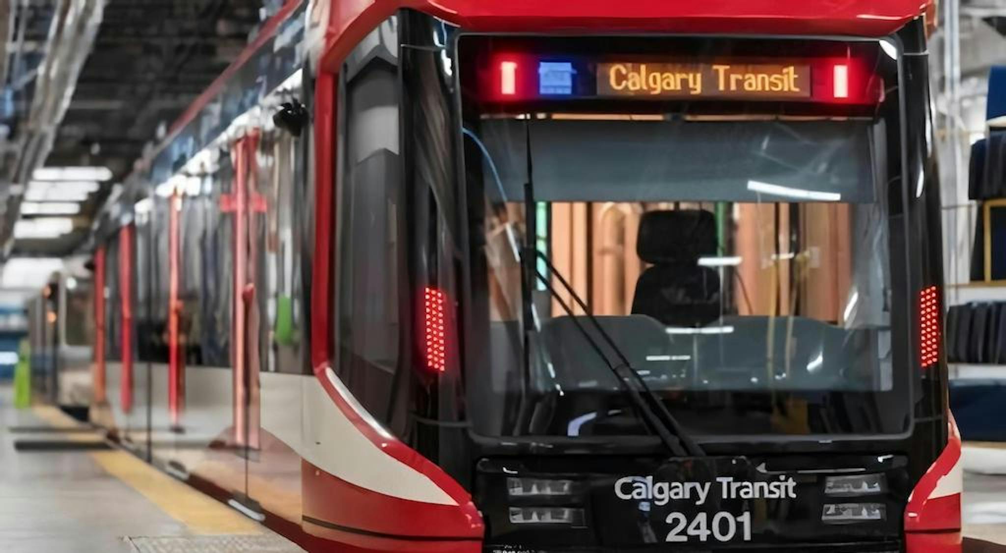 A red and white train labeled 'Calgary Transit 2401'