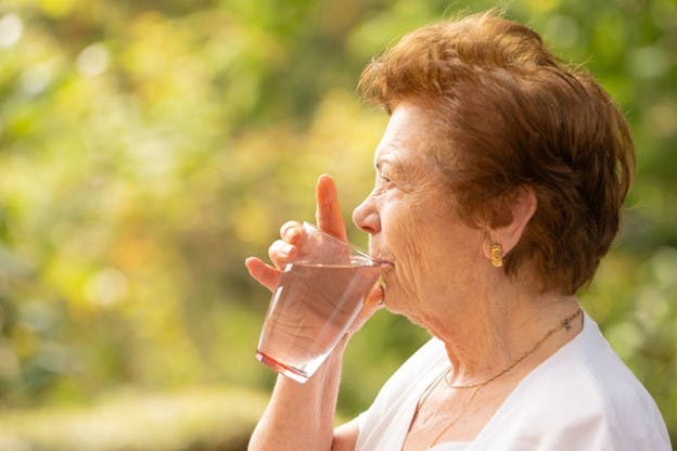 Hydration Affects Organ Function Woman Drinks from Glass