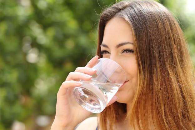 Woman Drinks Fresh Glass of Water