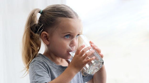 TTHMs in Tap Water Concern Child Drinks From Glass
