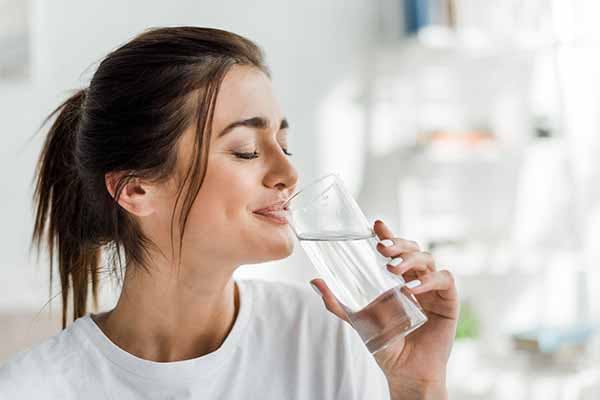 Woman Drinking Softened Softener Water