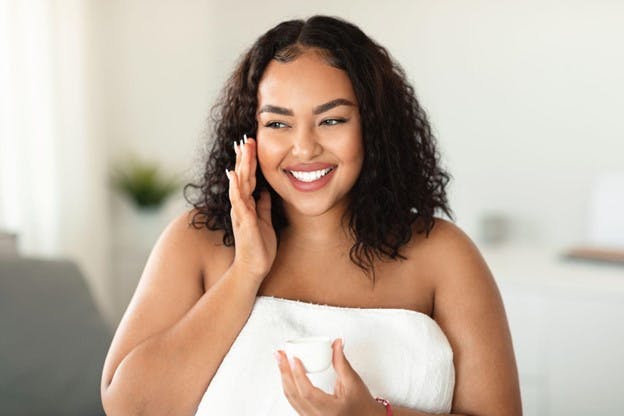 Girl Smiles With Fresh Skin Towel Around Her