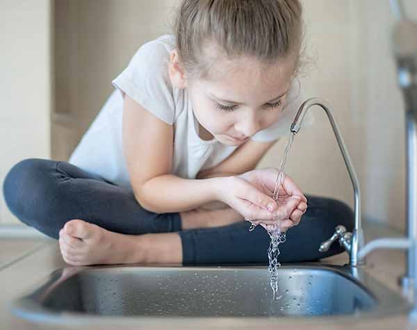 Water Amount to Drink for Day Child Drinking from Faucet