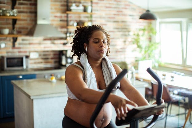 Woman Exercises on Treadmill